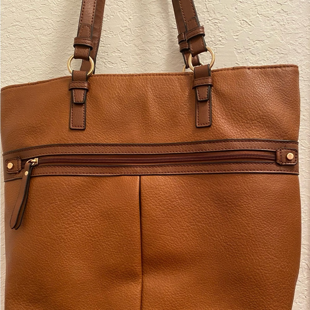 Brown Travel Bag with Pebbled Texture and Buckle Details
